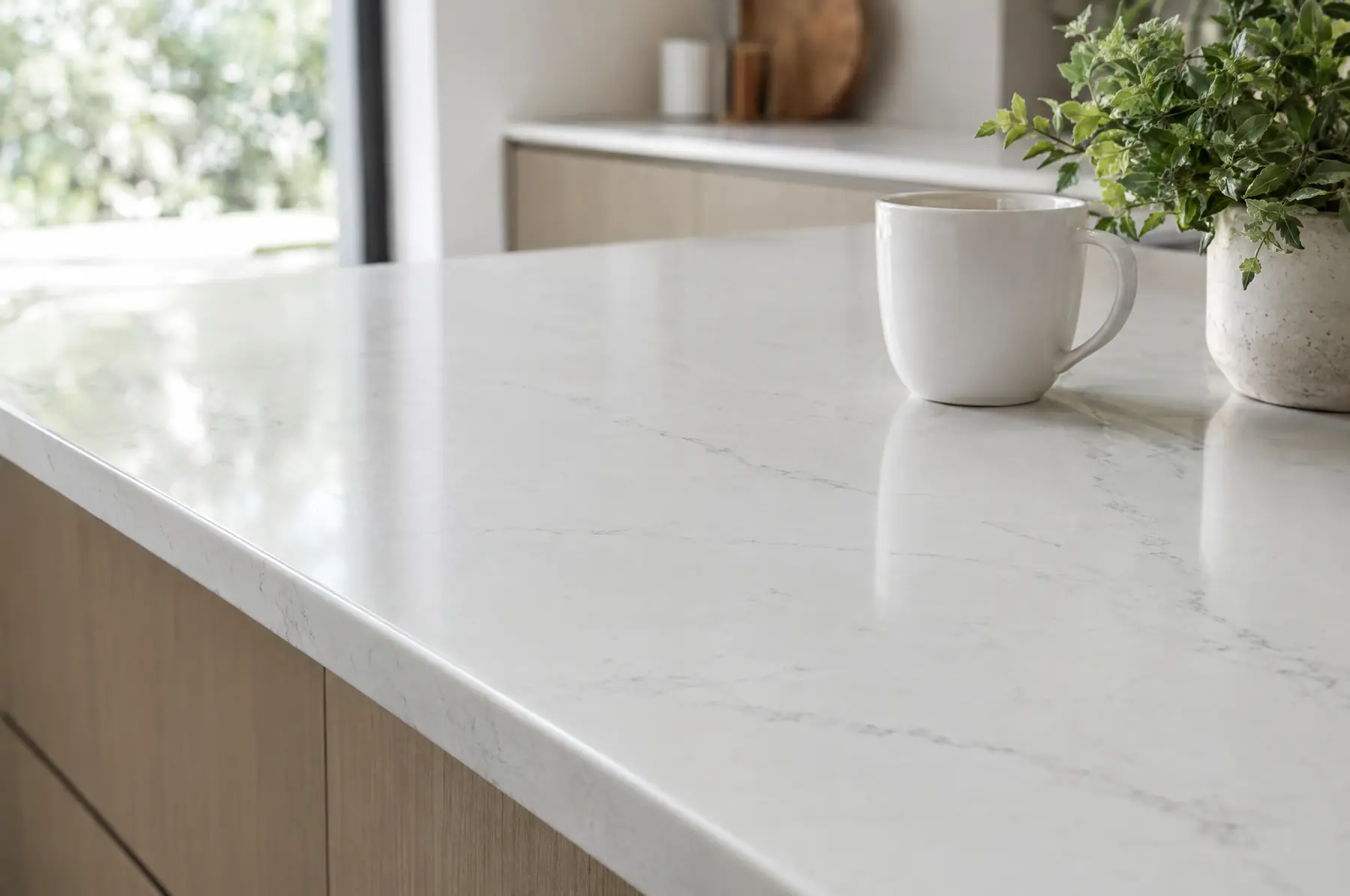 White quartz worktop in a bright kitchen